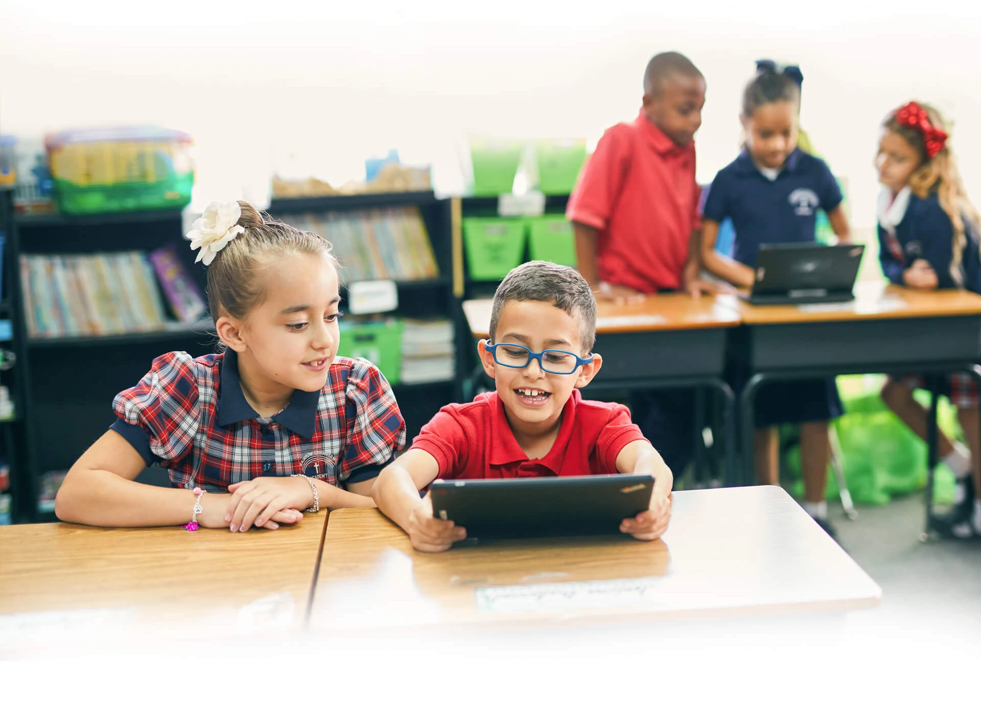 Students at Rainbow Christian Academy using their tablets in the classroom to learn